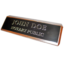 This elegant, genuine Illinois notary walnut desk, sign is made of solid wood and engraved on a metal plate with gold lettering with your notary name and the wording 'Notary Public'. It makes a fine addition to any desk or office. This sign can be customized with up to two lines.